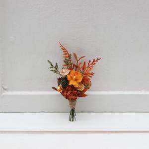 Wedding boutonniere in terracotta rust orange tones. 5331