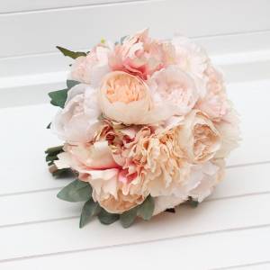 Bridal bouquet of classic round shape in peach and blush pink colors. Faux blooms for a wedding. 5412