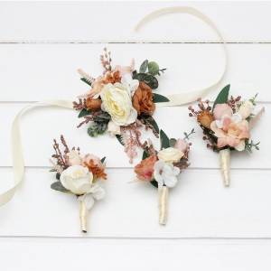 Rust, terracotta, caramel, cream, ivory and eucalyptus green wedding accessory set. Faux boutonnières and wrist corsage for groom, groomsmen, and mothers.  5418