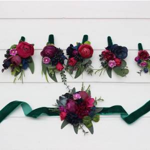  Wedding boutonnieres and wrist corsage  in jewel tone color scheme. Flower accessories  in deep navy blue, magenta, fuchsia, purple, and emerald green. 5416