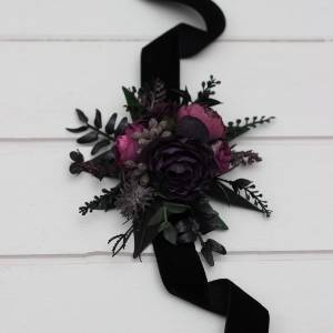 Wrist corsage in a black, purple, and magenta colors. 5370